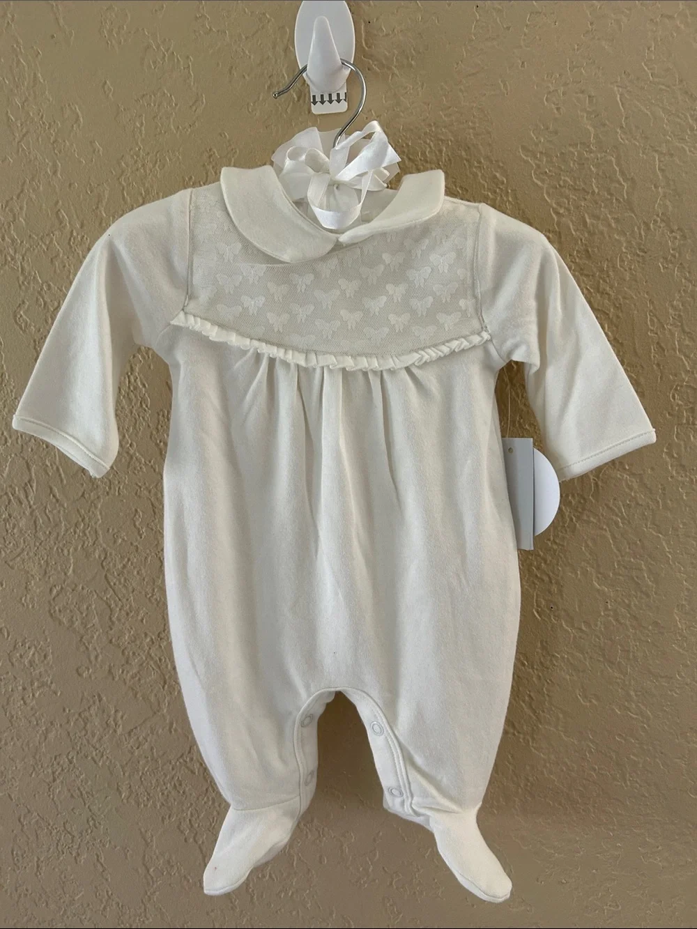 Edgehill Collection Ivory Footed Baby One-Piece with bow detail. NB